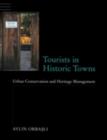 Tourists in Historic Towns : Urban Conservation and Heritage Management - eBook